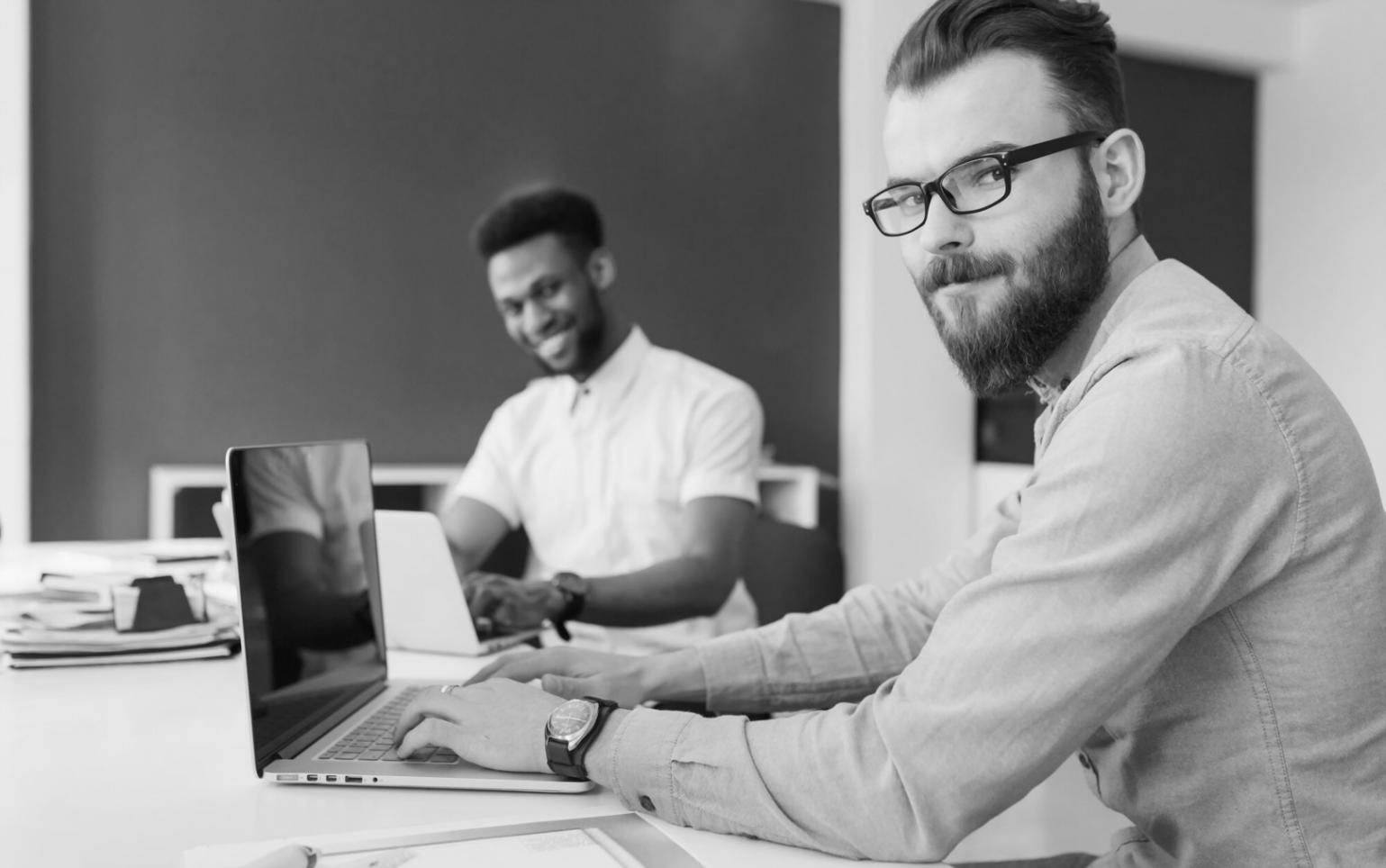 Webinar participant reviewing financial planning materials and taking notes